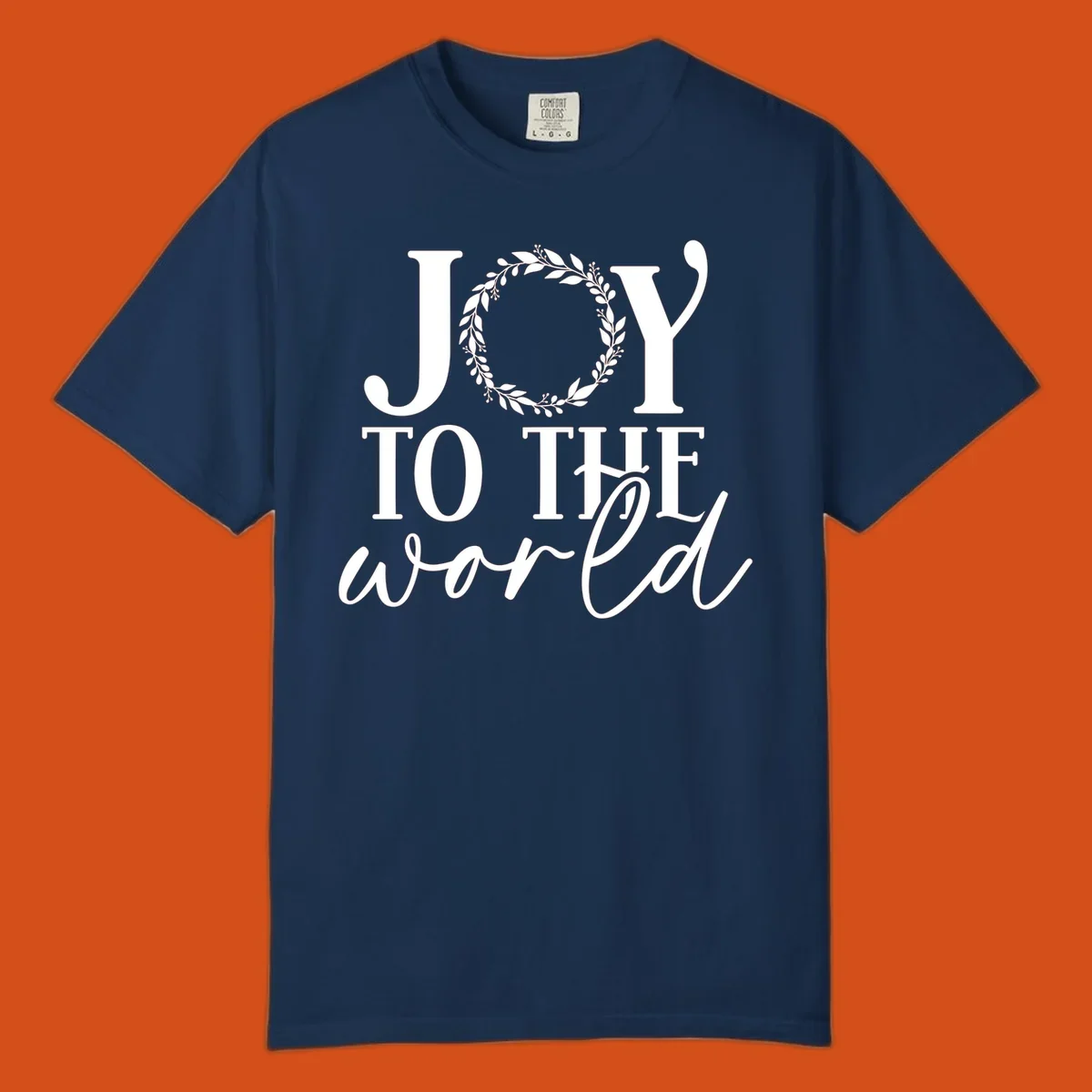 Joy to the World Christmas text design with a wreath replacing the letter O. White text on black background.