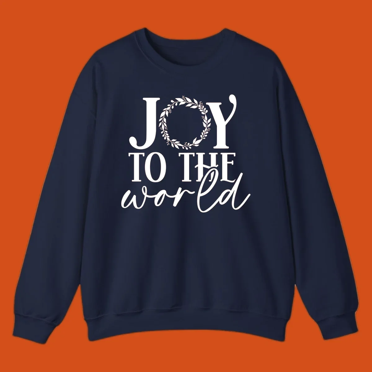 Joy to the World Christmas text design with a wreath replacing the letter O. White text on black background.
