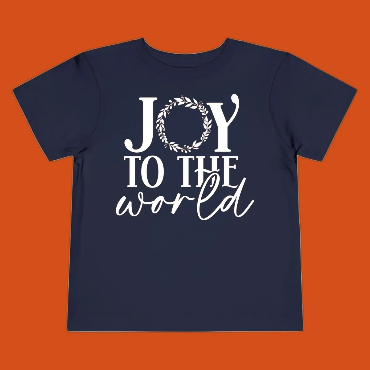 Joy to the World Christmas text design with a wreath replacing the letter O. White text on black background.