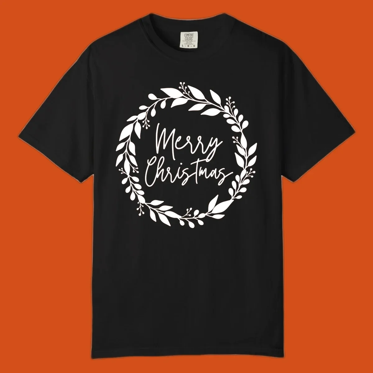 Merry Christmas text inside a white floral wreath graphic.