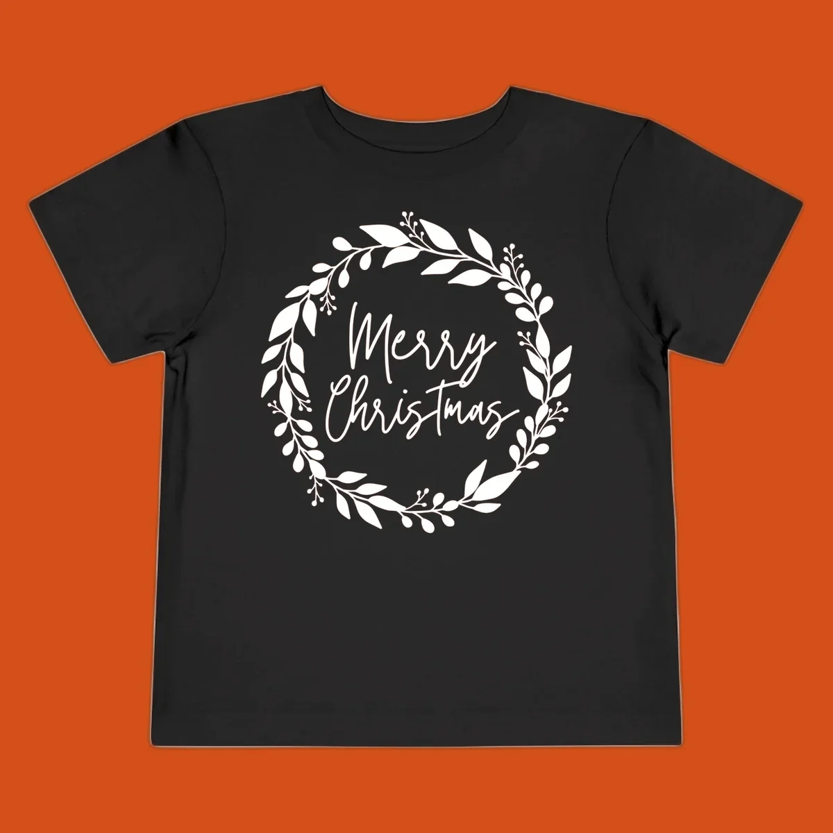 Merry Christmas text inside a white floral wreath graphic.