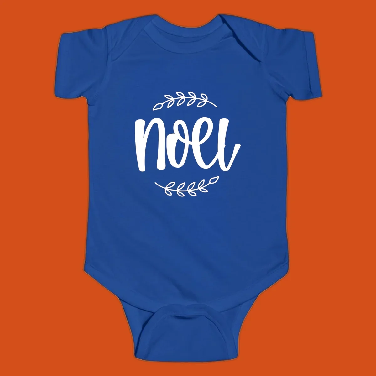 Elegant christmas noel script with leafy branches.
