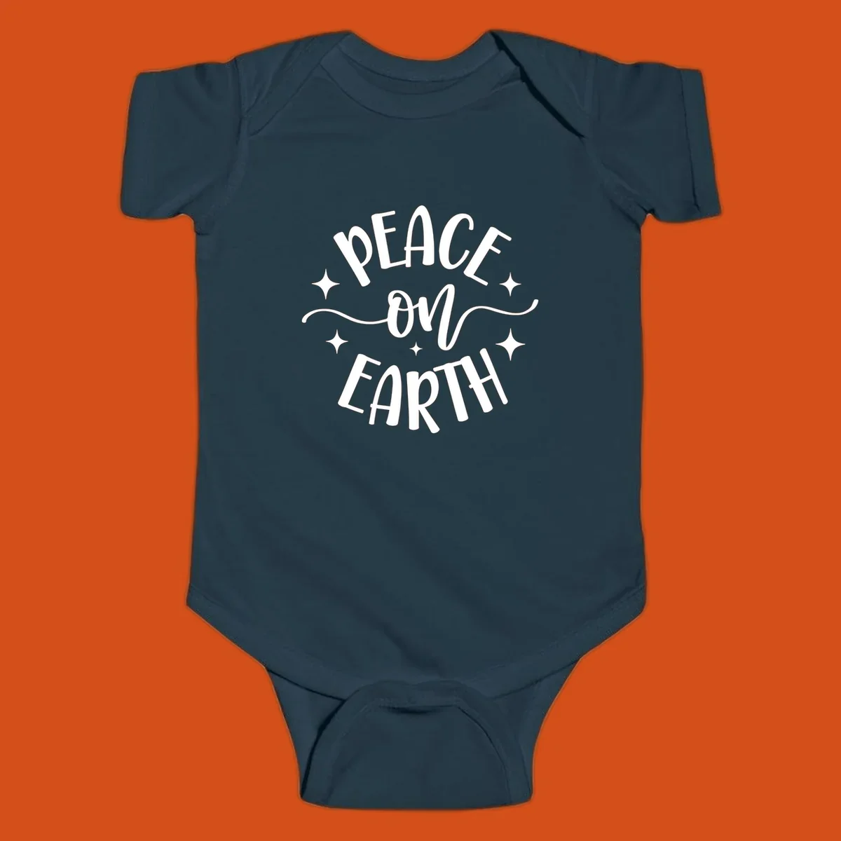 Peace on Earth holiday typography design with stars and swirls.