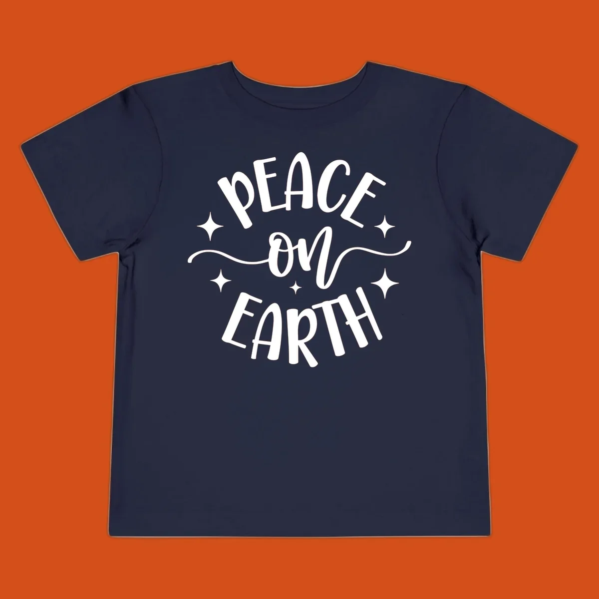 Peace on Earth holiday typography design with stars and swirls.
