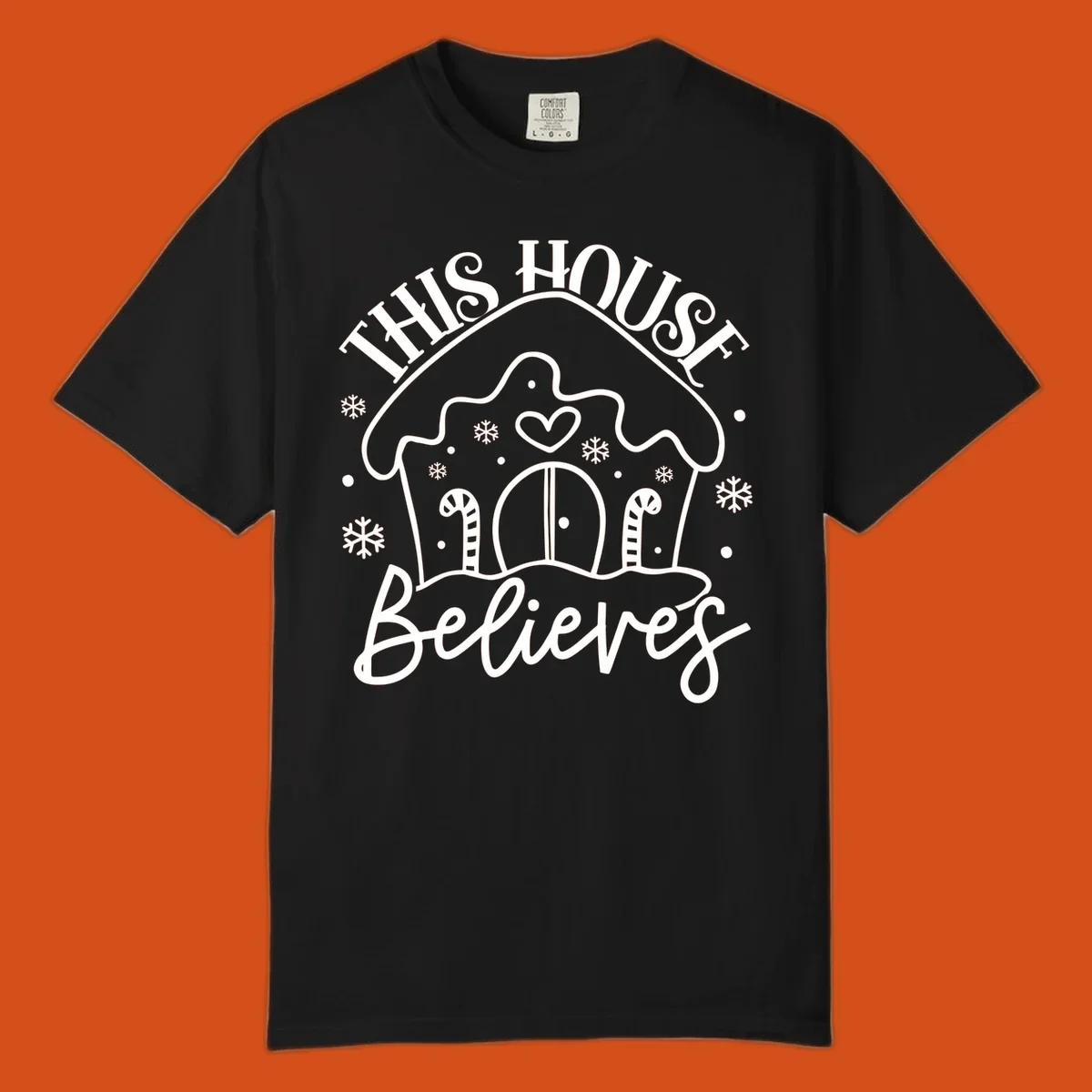 Gingerbread house graphic with 'This House Believes' text for Christmas.