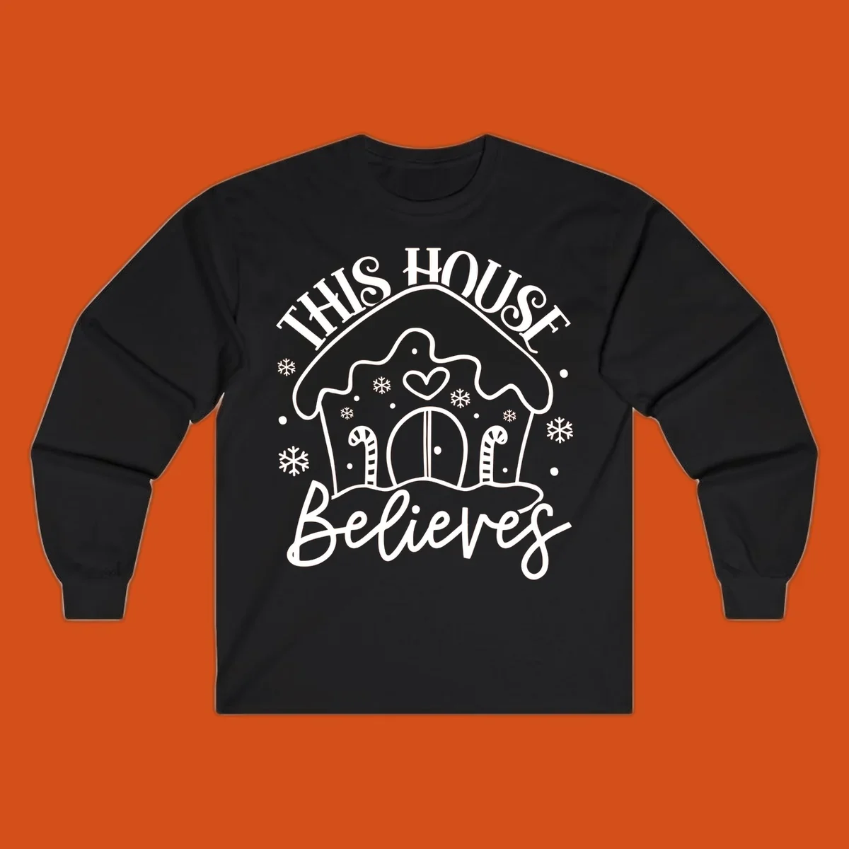Gingerbread house graphic with 'This House Believes' text for Christmas.