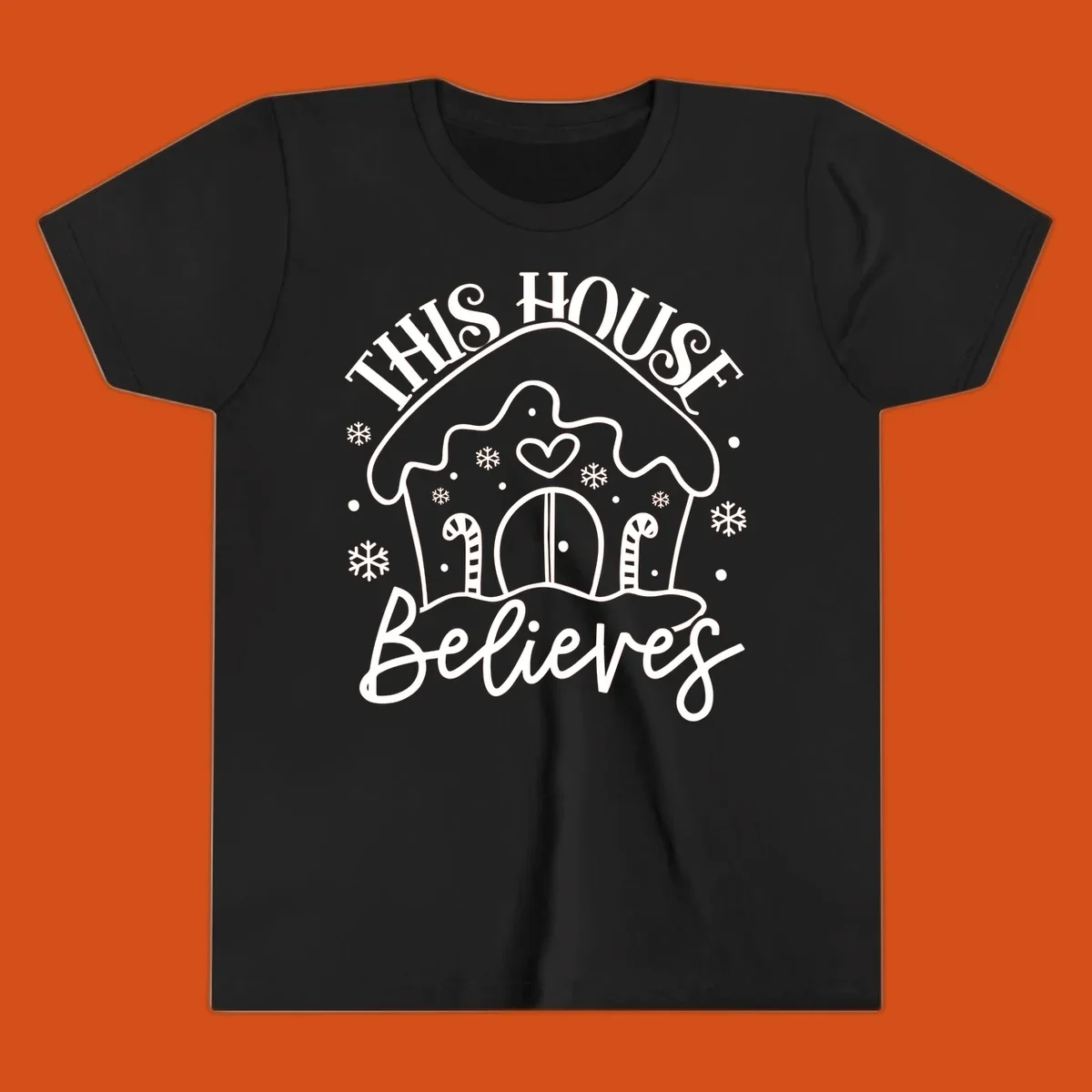 Gingerbread house graphic with 'This House Believes' text for Christmas.