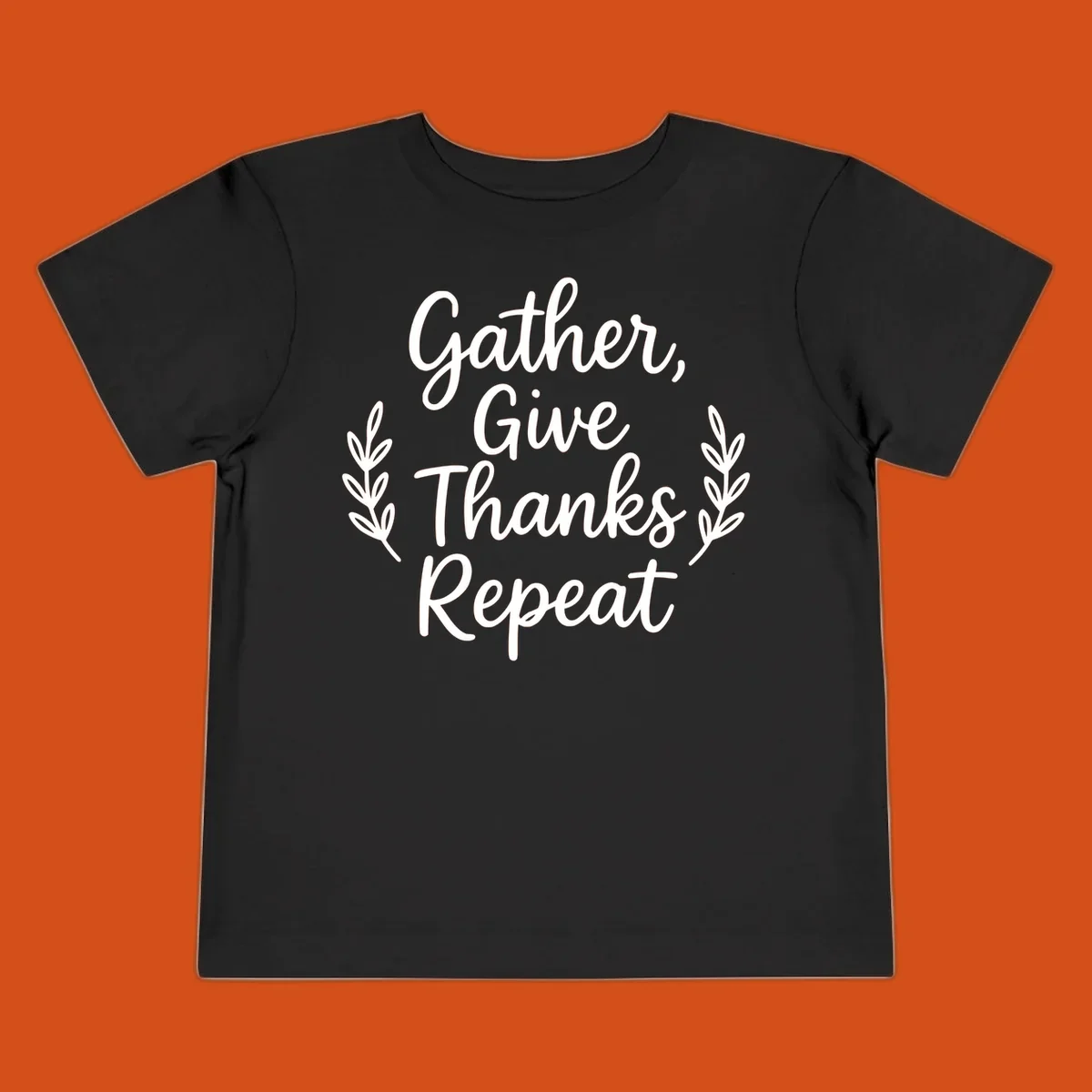 Thanksgiving gather repeat phrase in white typography with leaf accents.