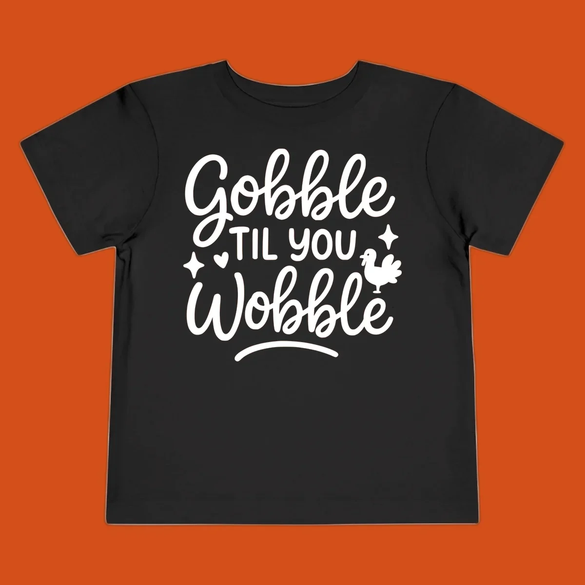 Gobble Til You Wobble Thanksgiving turkey graphic with fun lettering.