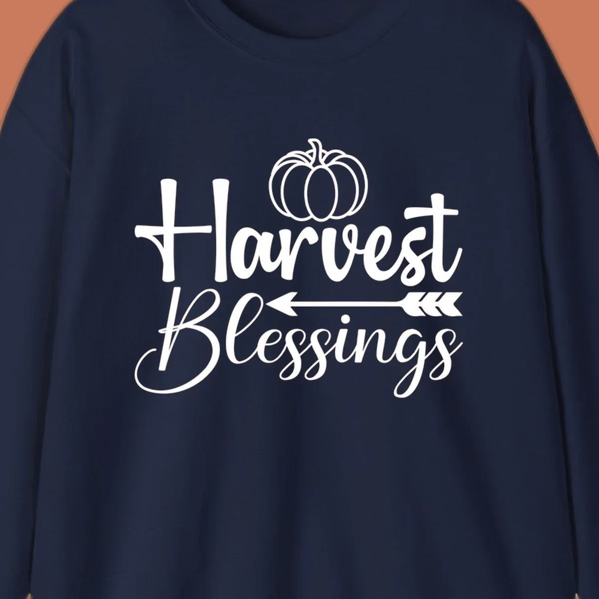 Harvest Blessings text with pumpkin and arrow illustration for autumn season.