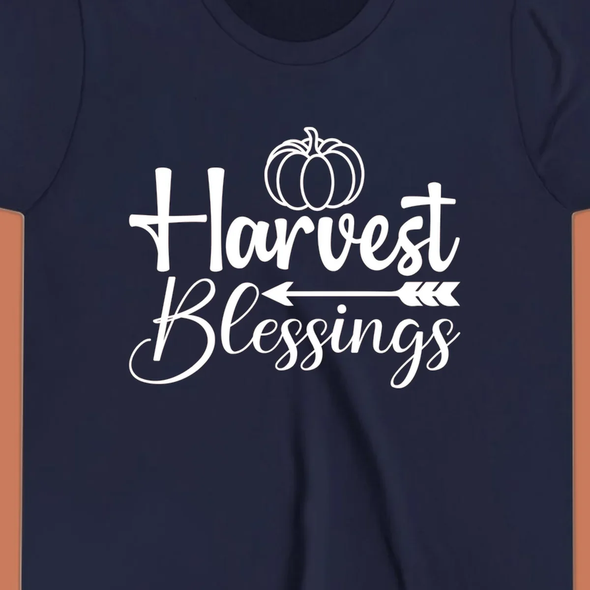 Harvest Blessings text with pumpkin and arrow illustration for autumn season.