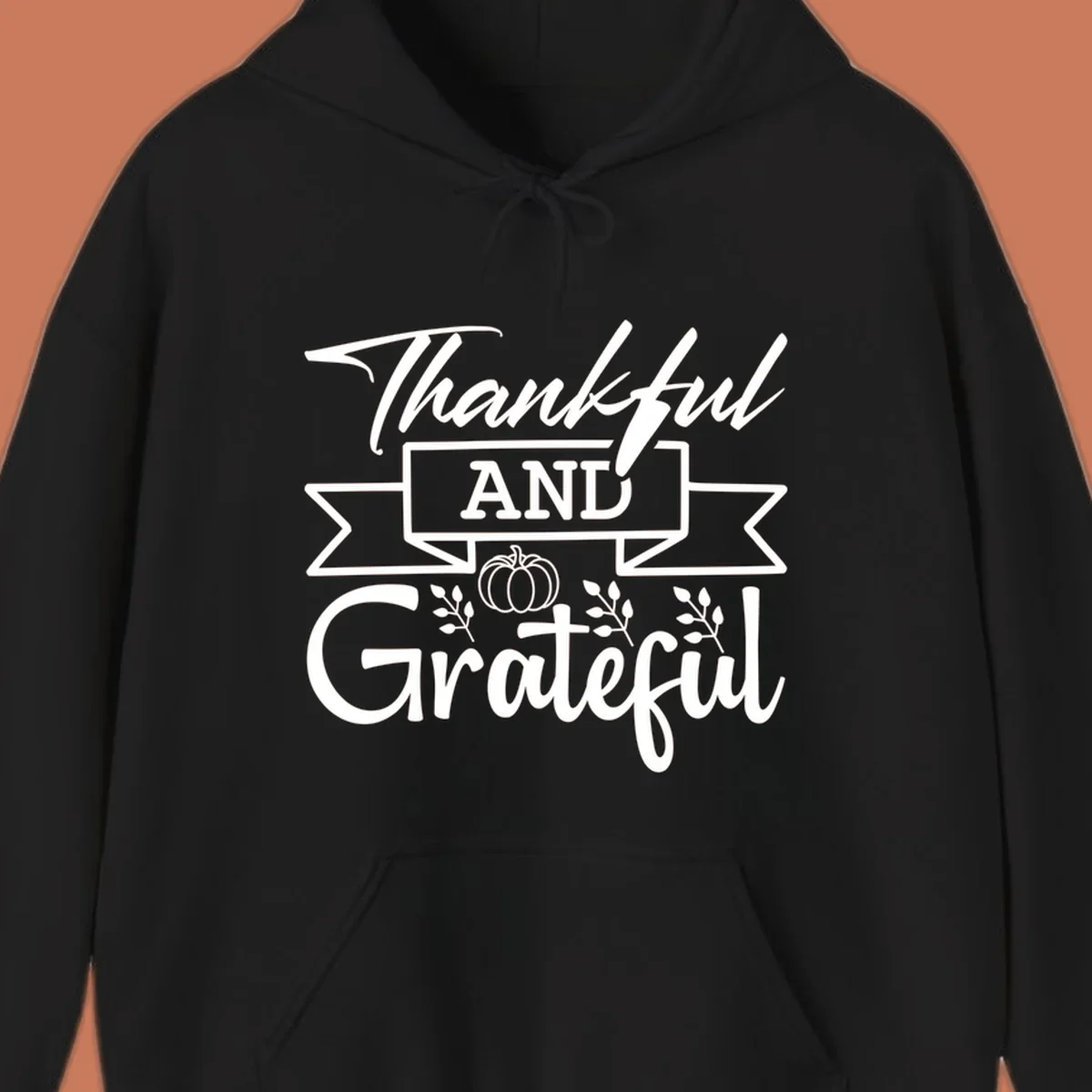 Thankful and Grateful autumn design with pumpkin and leaves.