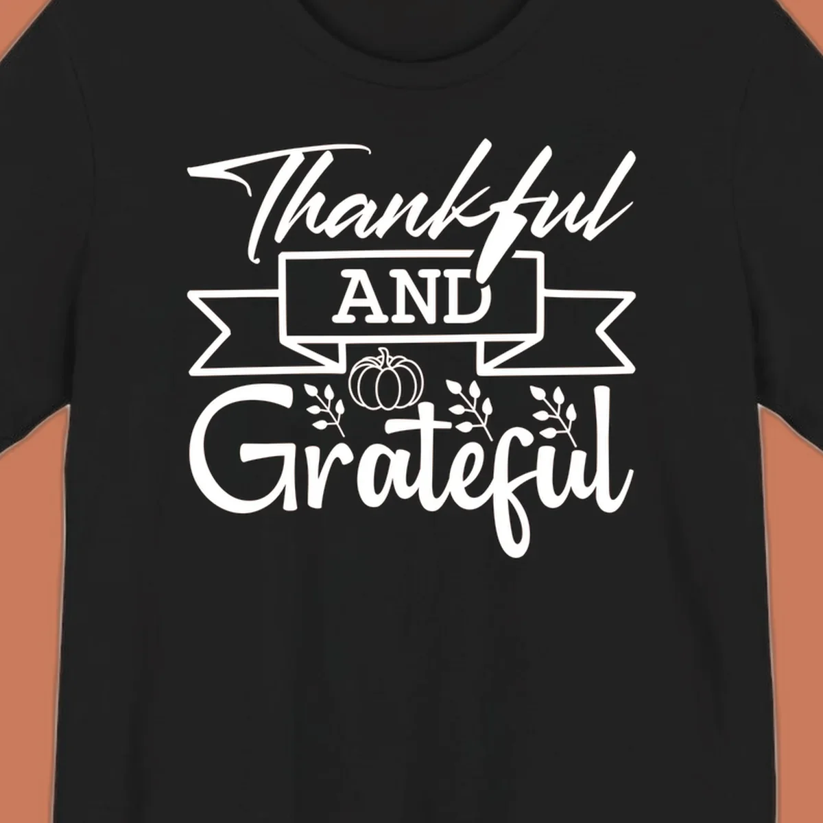Thankful and Grateful autumn design with pumpkin and leaves.