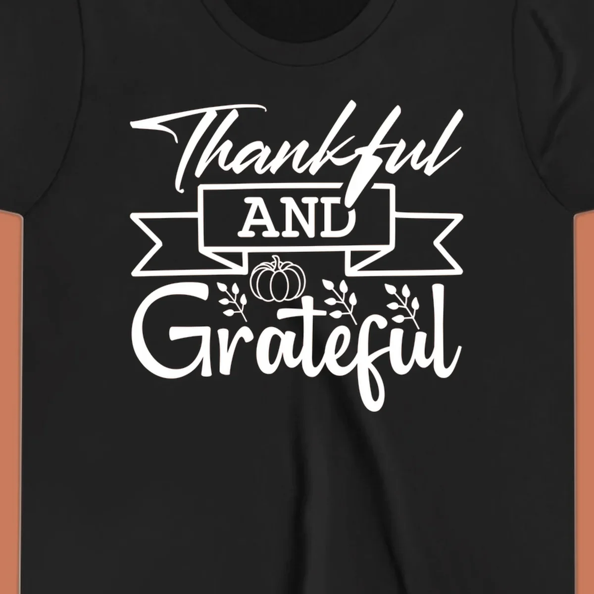 Thankful and Grateful autumn design with pumpkin and leaves.