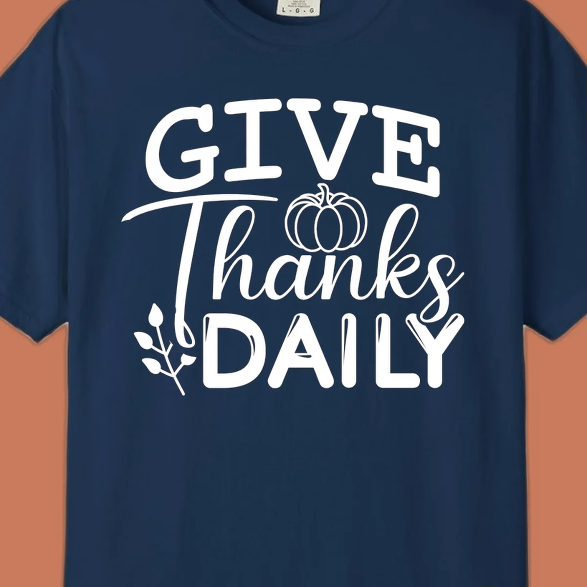 Give Thanks Daily text with a pumpkin and leaf sprig.