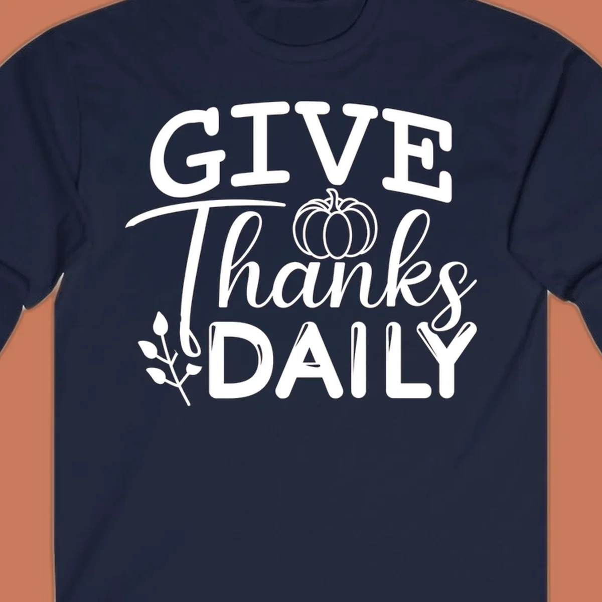 Give Thanks Daily text with a pumpkin and leaf sprig.