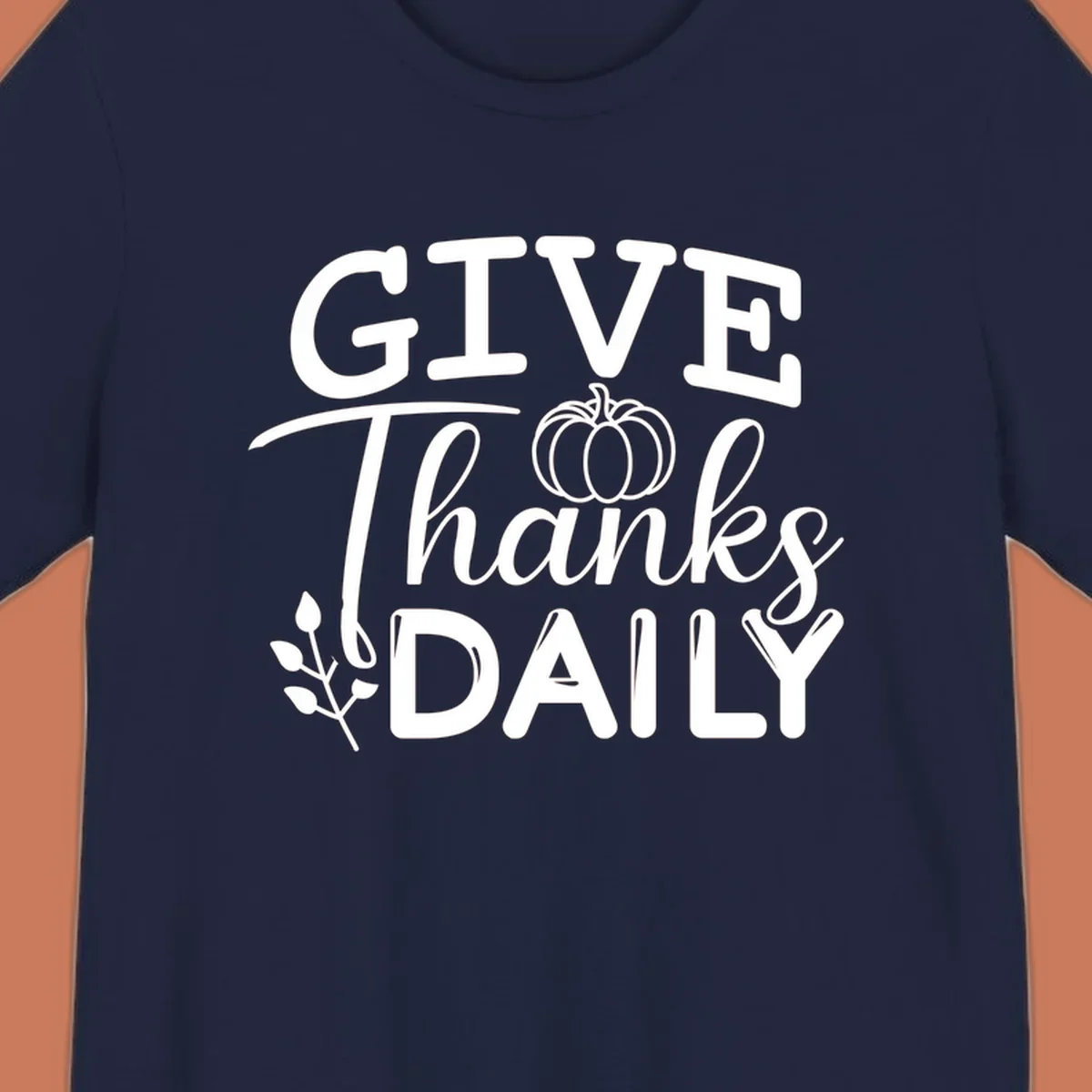 Give Thanks Daily text with a pumpkin and leaf sprig.