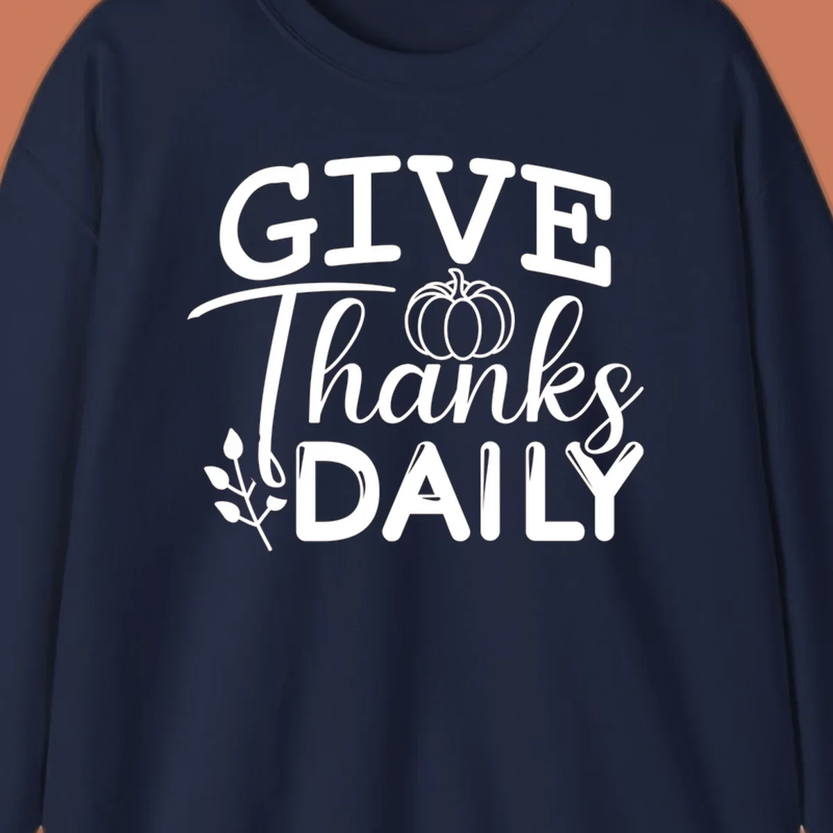 Give Thanks Daily text with a pumpkin and leaf sprig.