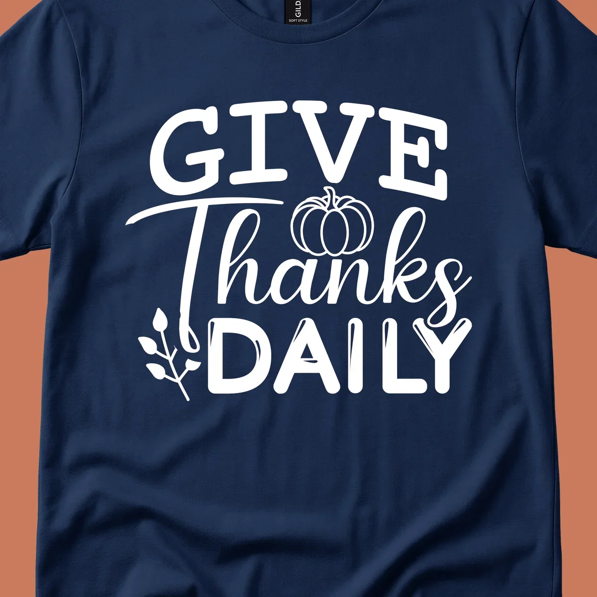 Give Thanks Daily text with a pumpkin and leaf sprig.