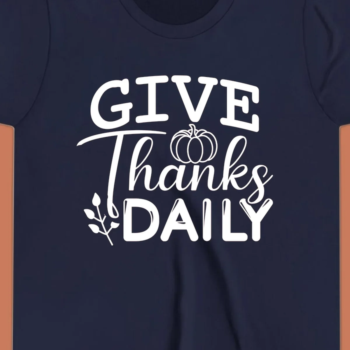 Give Thanks Daily text with a pumpkin and leaf sprig.