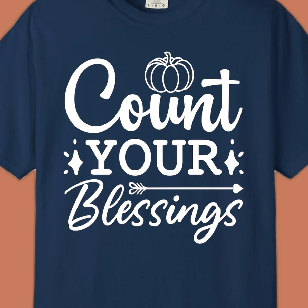 Count your blessings text with pumpkin and arrow graphic, in white.