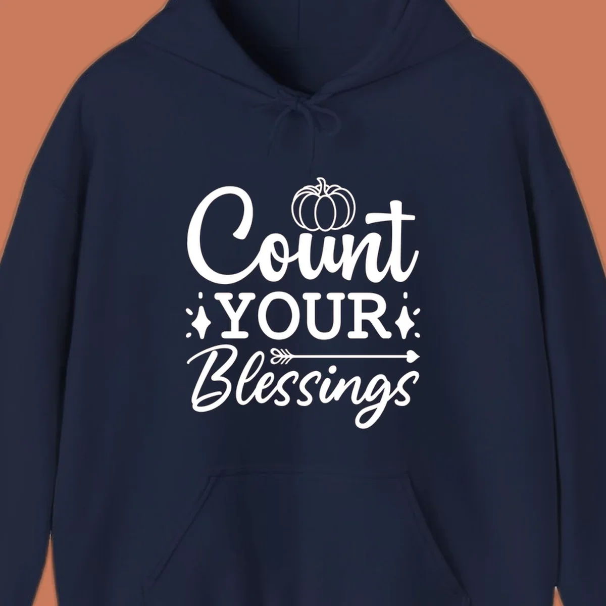 Count your blessings text with pumpkin and arrow graphic, in white.