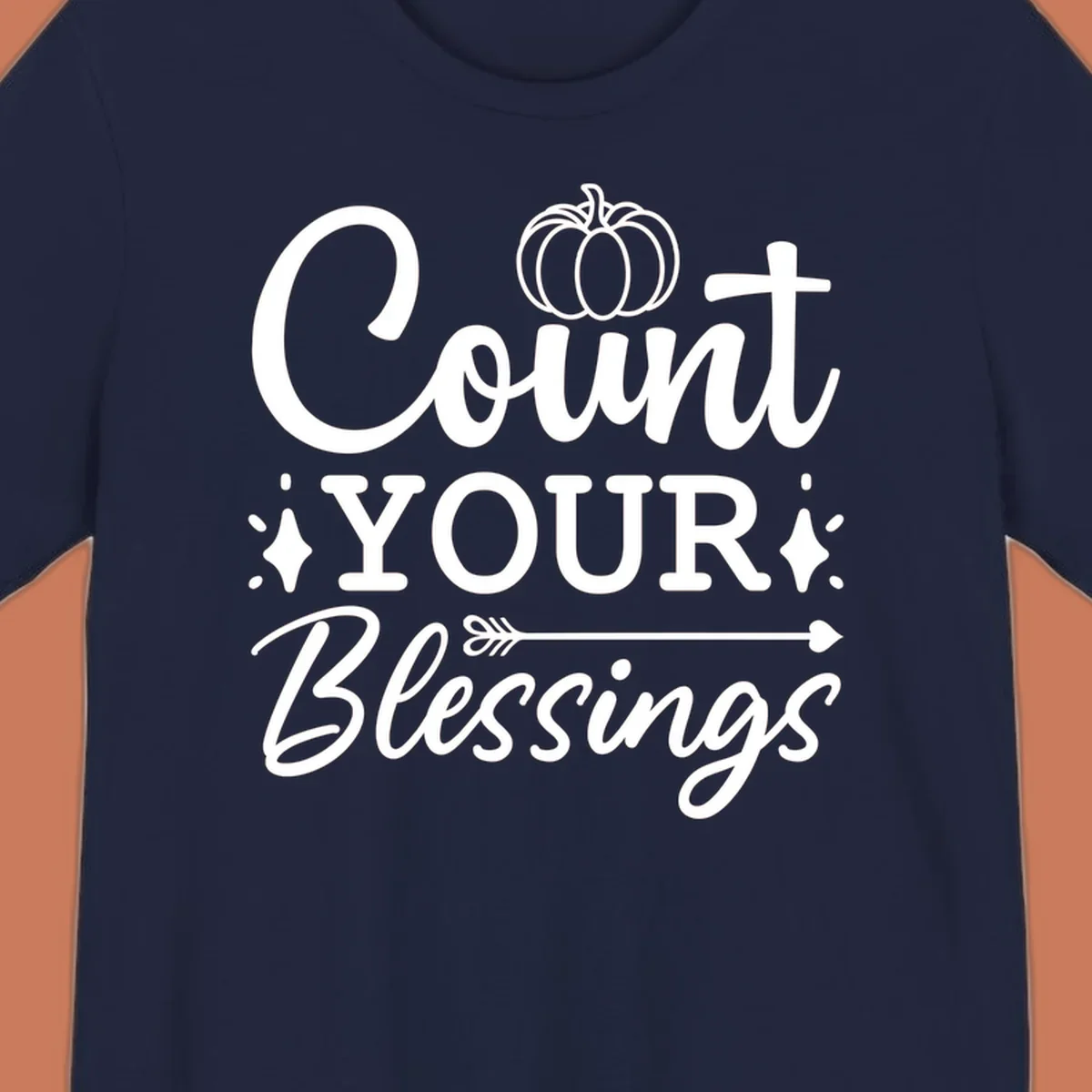 Count your blessings text with pumpkin and arrow graphic, in white.