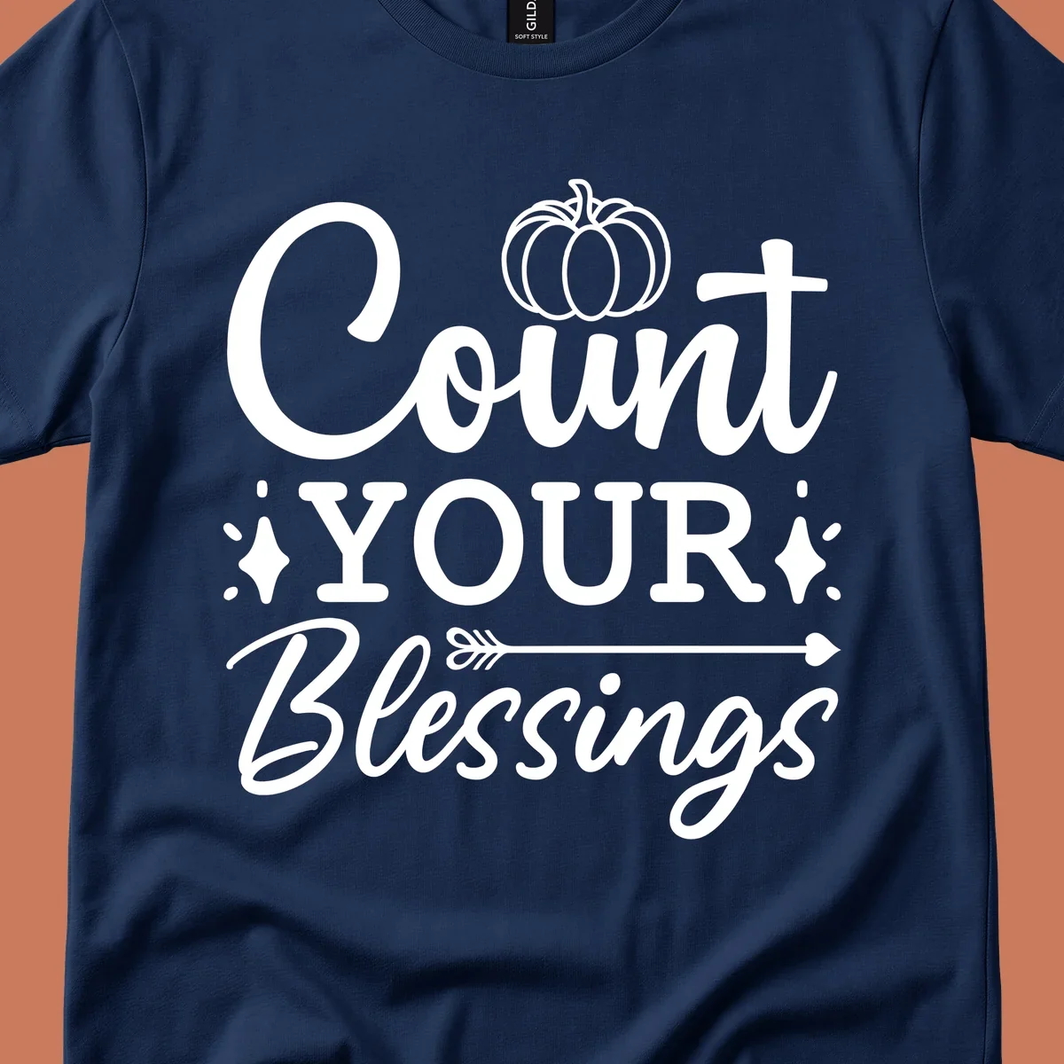 Count your blessings text with pumpkin and arrow graphic, in white.