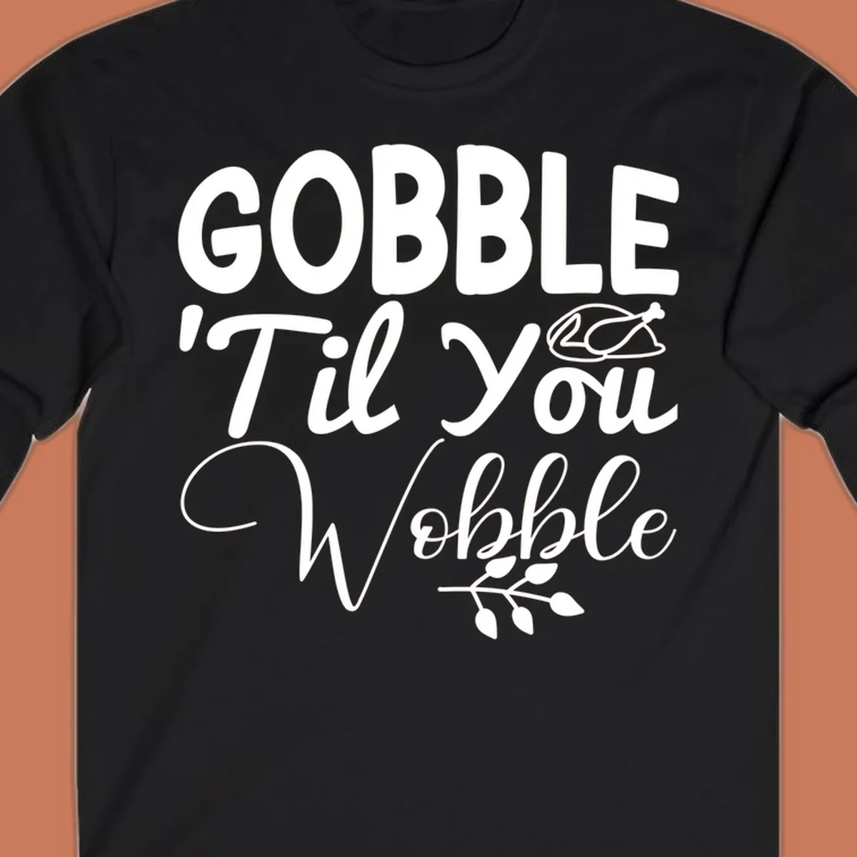 Gobble wobble thanksgiving phrase with roasted turkey illustration and leafy branch.