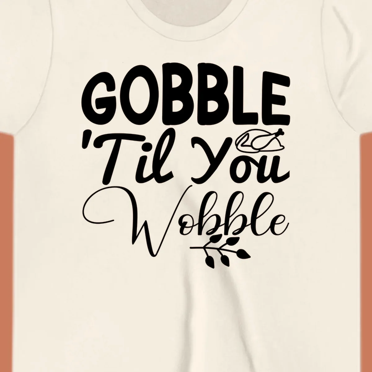 Gobble wobble thanksgiving phrase with roasted turkey illustration and leafy branch.