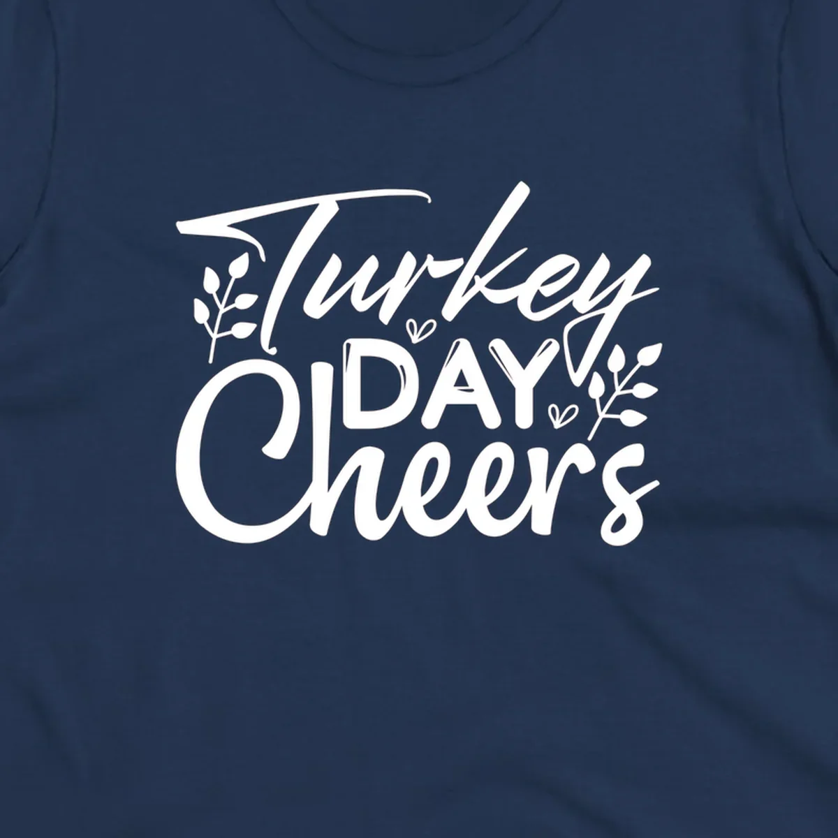 Typography design with "Turkey DAY Cheers" and decorative leaves, a Thanksgiving sentiment.