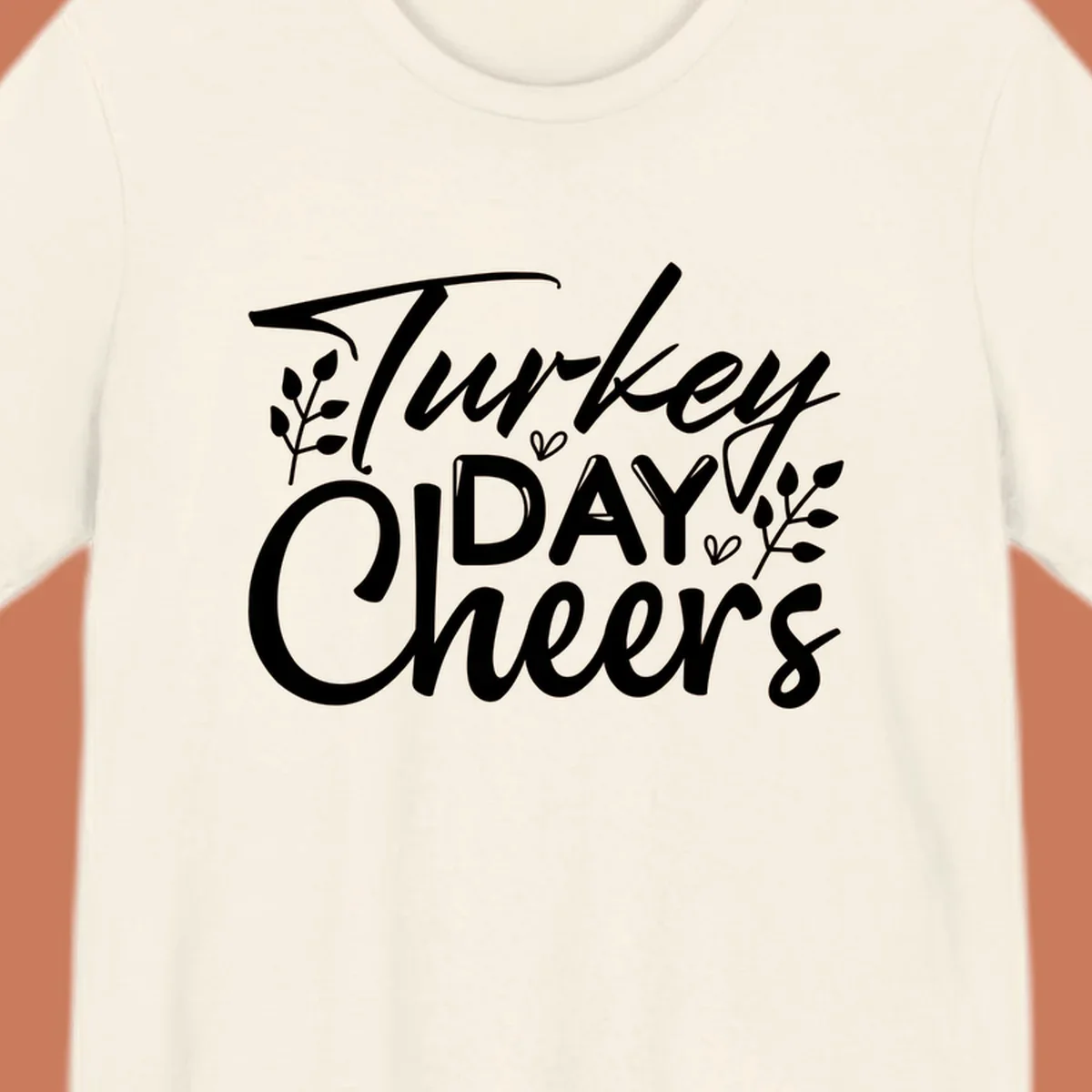 Typography design with "Turkey DAY Cheers" and decorative leaves, a Thanksgiving sentiment.