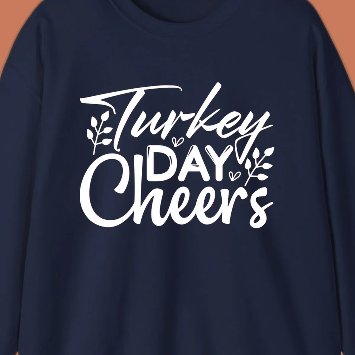 Typography design with "Turkey DAY Cheers" and decorative leaves, a Thanksgiving sentiment.