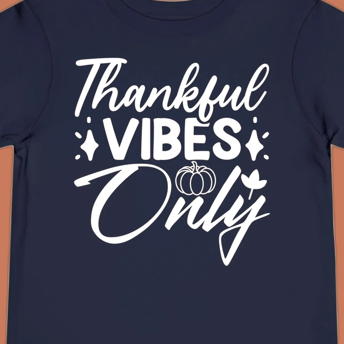 Thankful Vibes Only graphic with pumpkin and flower, white text on black.