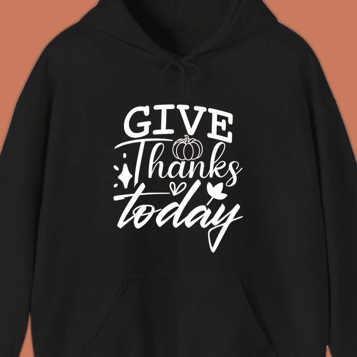 Give Thanks Today typography design with pumpkin and leaf elements.