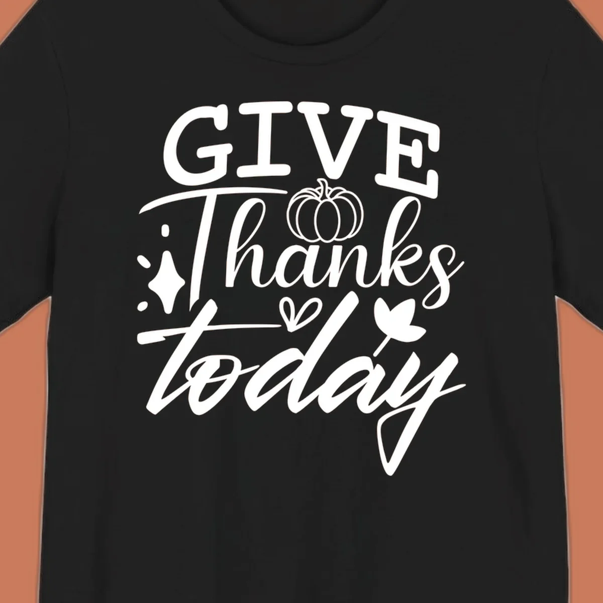 Give Thanks Today typography design with pumpkin and leaf elements.