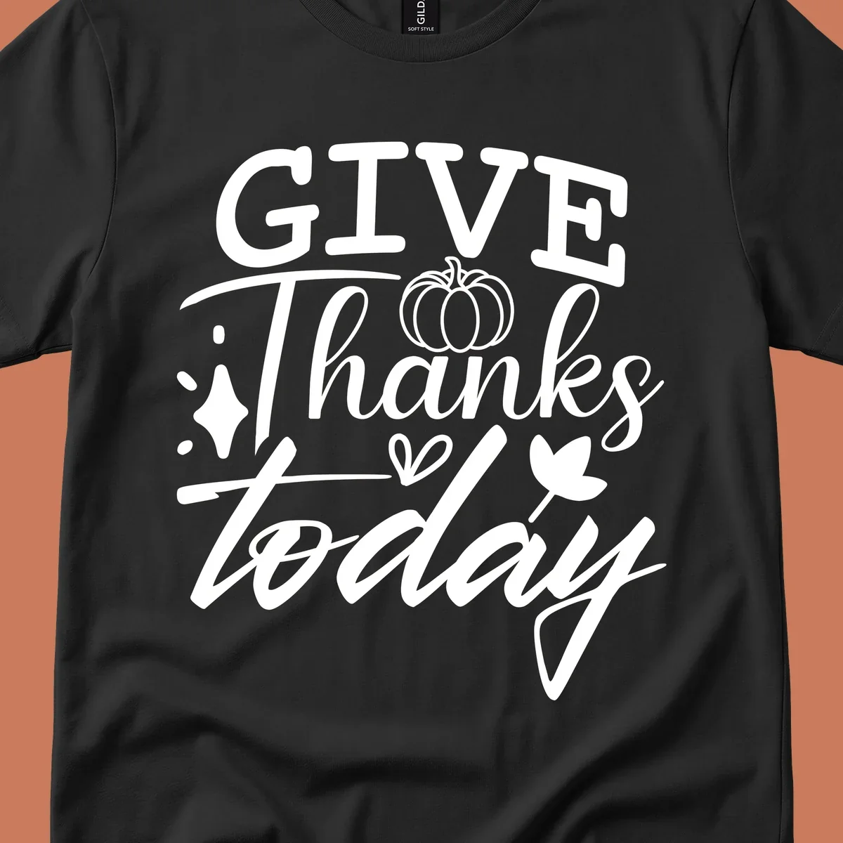Give Thanks Today typography design with pumpkin and leaf elements.
