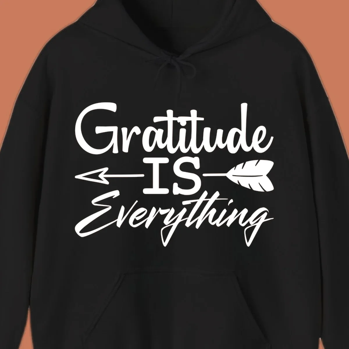 Gratitude Is Everything typography design with an arrow and feather graphic.