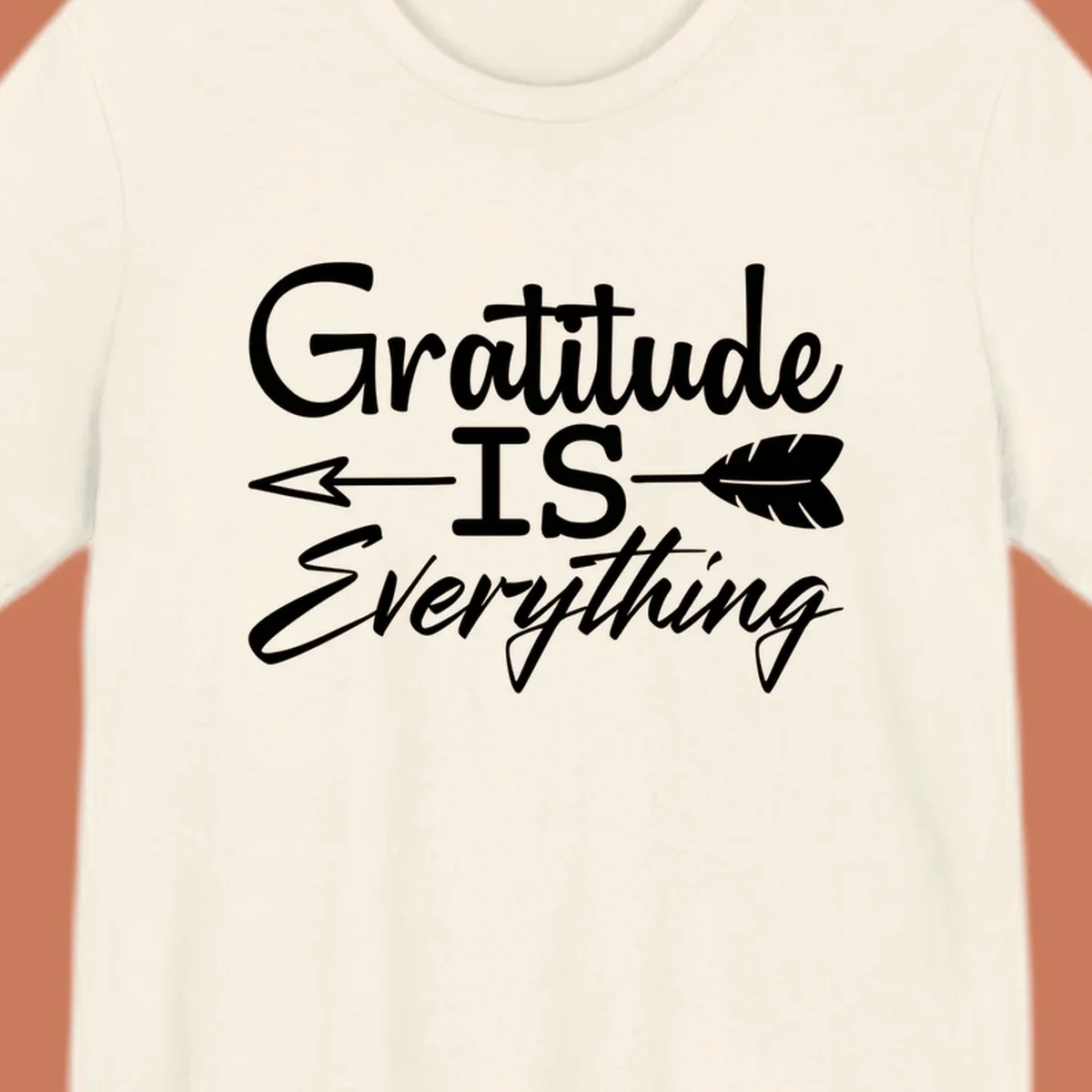 Gratitude Is Everything typography design with an arrow and feather graphic.