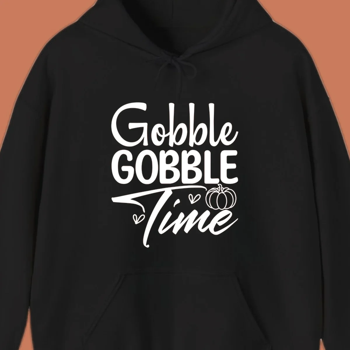 Gobble Gobble Time phrase with pumpkin and hearts, white typography on black background.