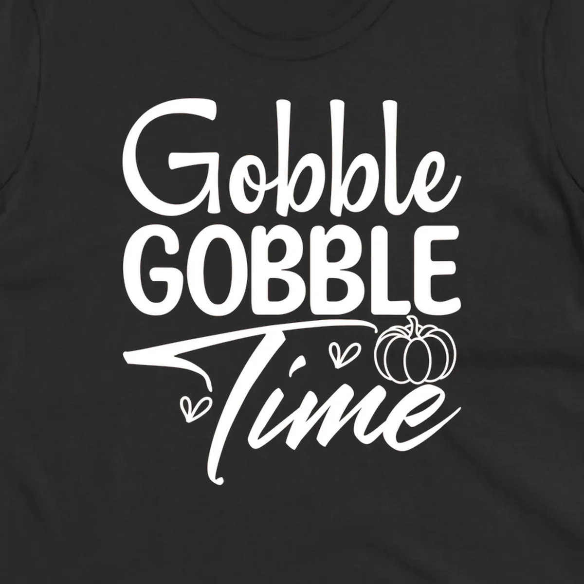 Gobble Gobble Time phrase with pumpkin and hearts, white typography on black background.