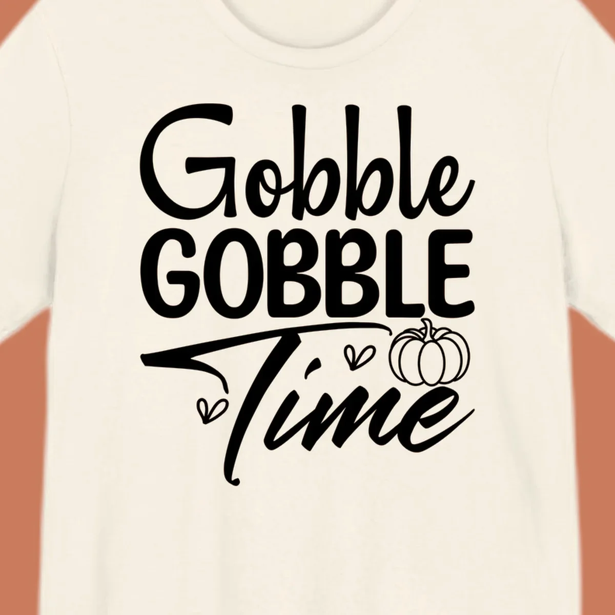 Gobble Gobble Time phrase with pumpkin and hearts, white typography on black background.