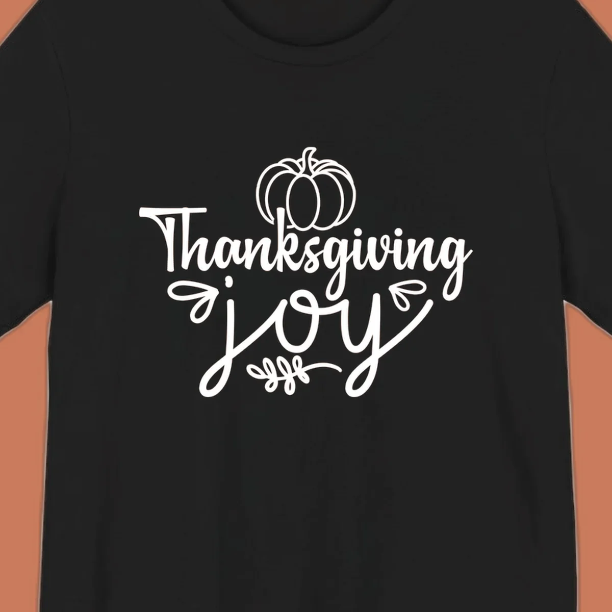 Thanksgiving Joy script text with a pumpkin illustration, for gratitude tees.