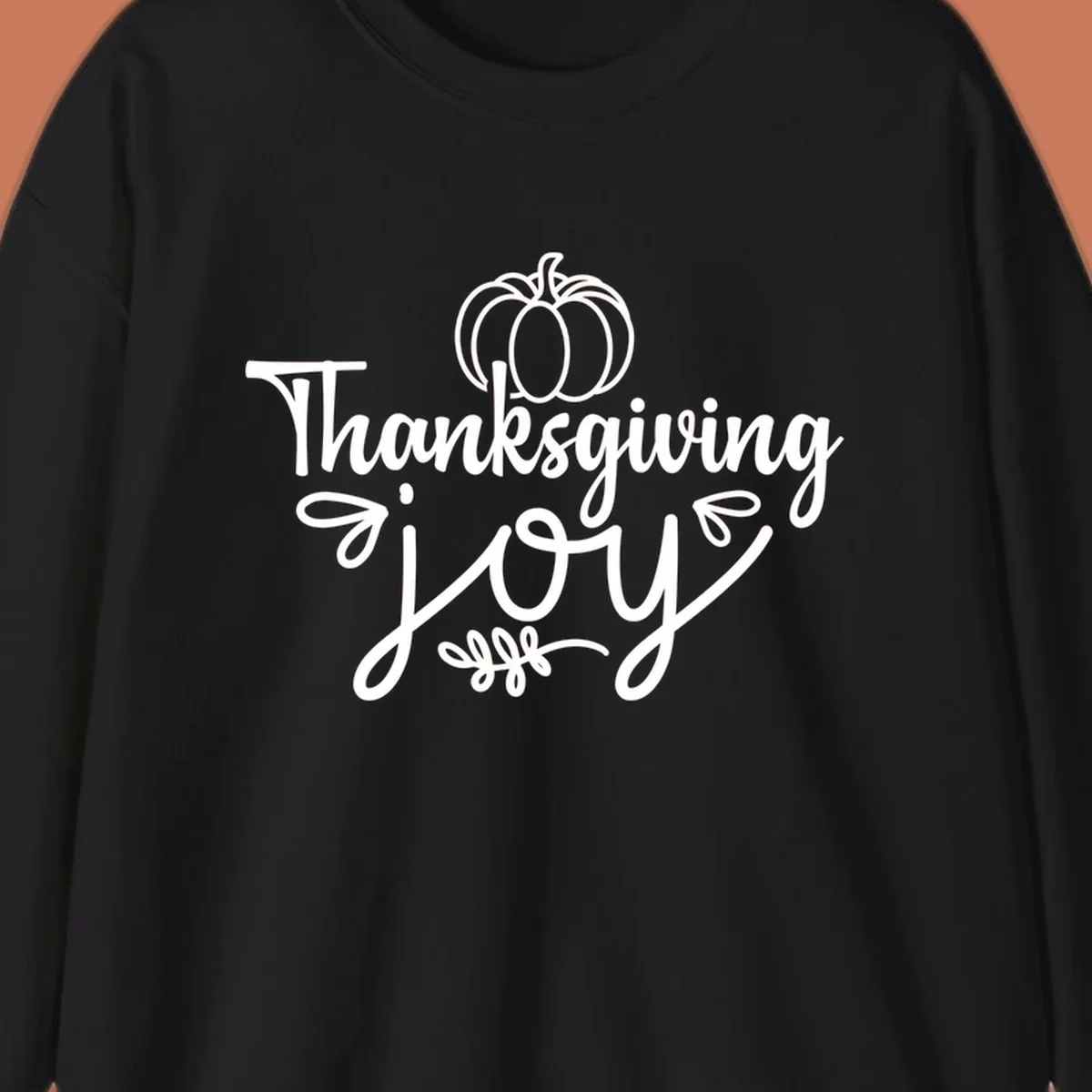Thanksgiving Joy script text with a pumpkin illustration, for gratitude tees.