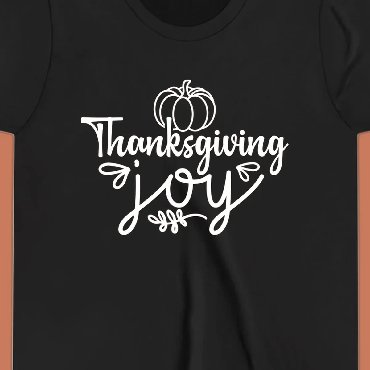 Thanksgiving Joy script text with a pumpkin illustration, for gratitude tees.