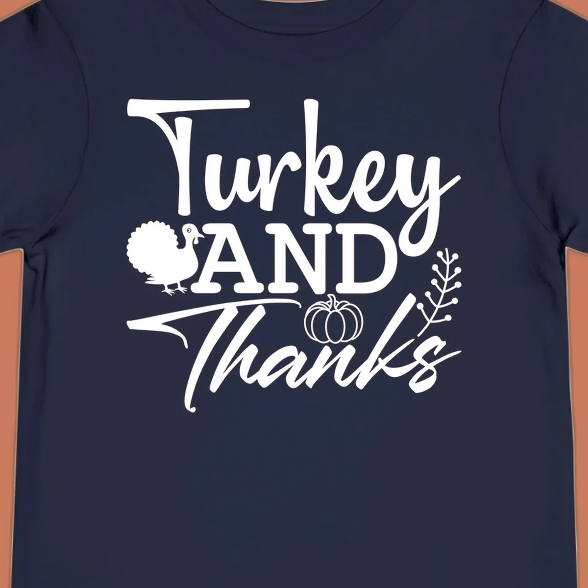 Thanksgiving turkey and thanks sentiment graphic with turkey, pumpkin, and leafy branch illustrations.