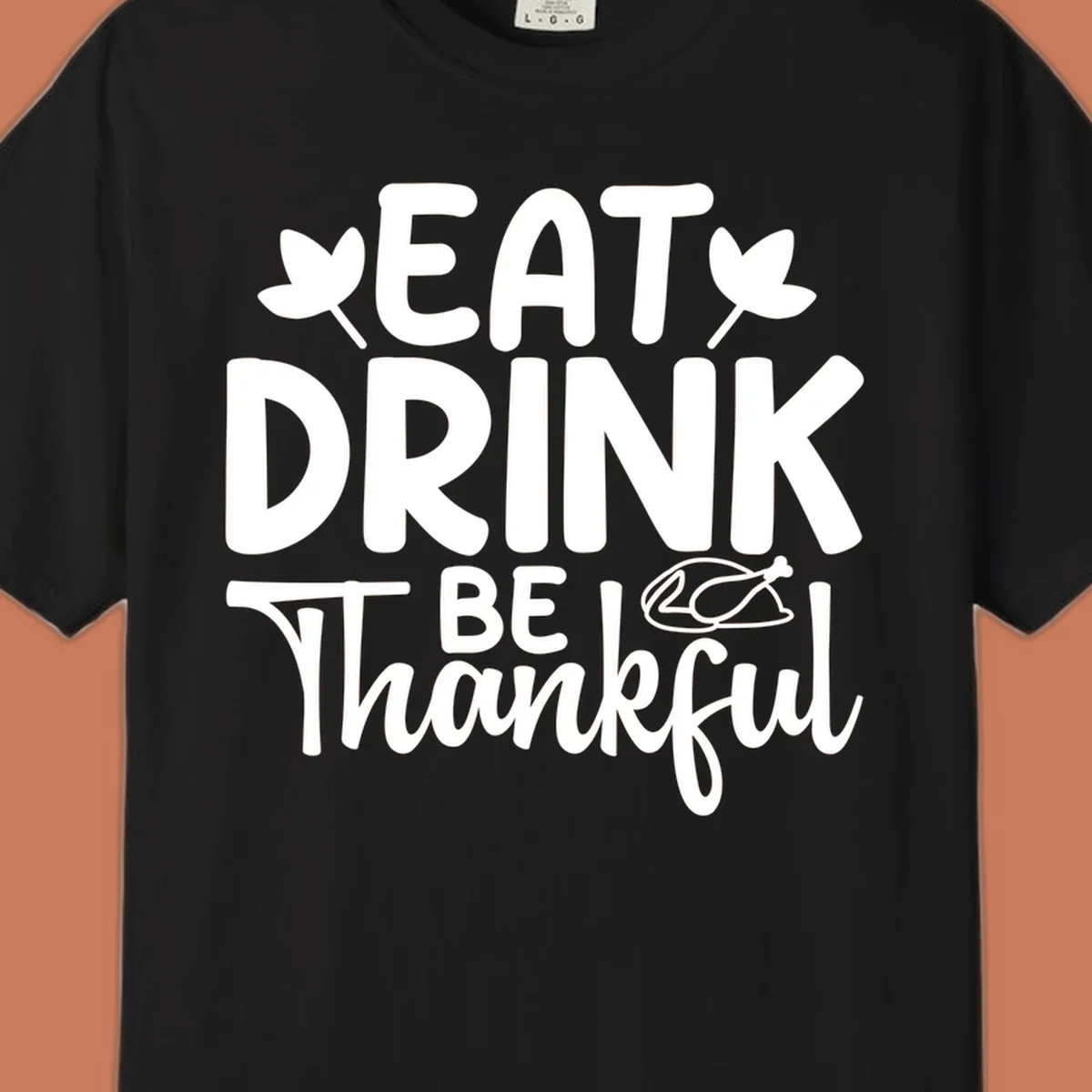 Eat Drink Be Thankful text with autumn leaves and a roasted chicken graphic.