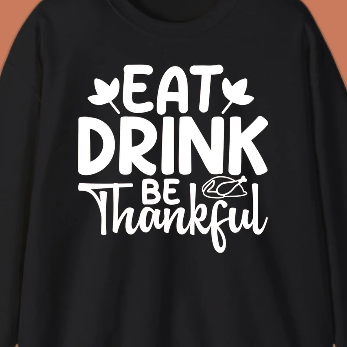Eat Drink Be Thankful text with autumn leaves and a roasted chicken graphic.