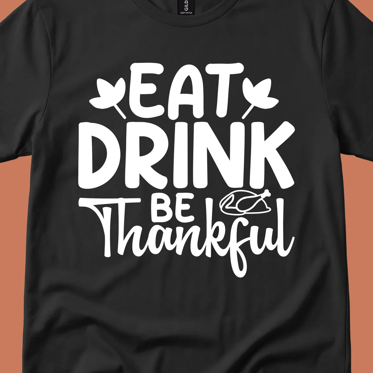 Eat Drink Be Thankful text with autumn leaves and a roasted chicken graphic.