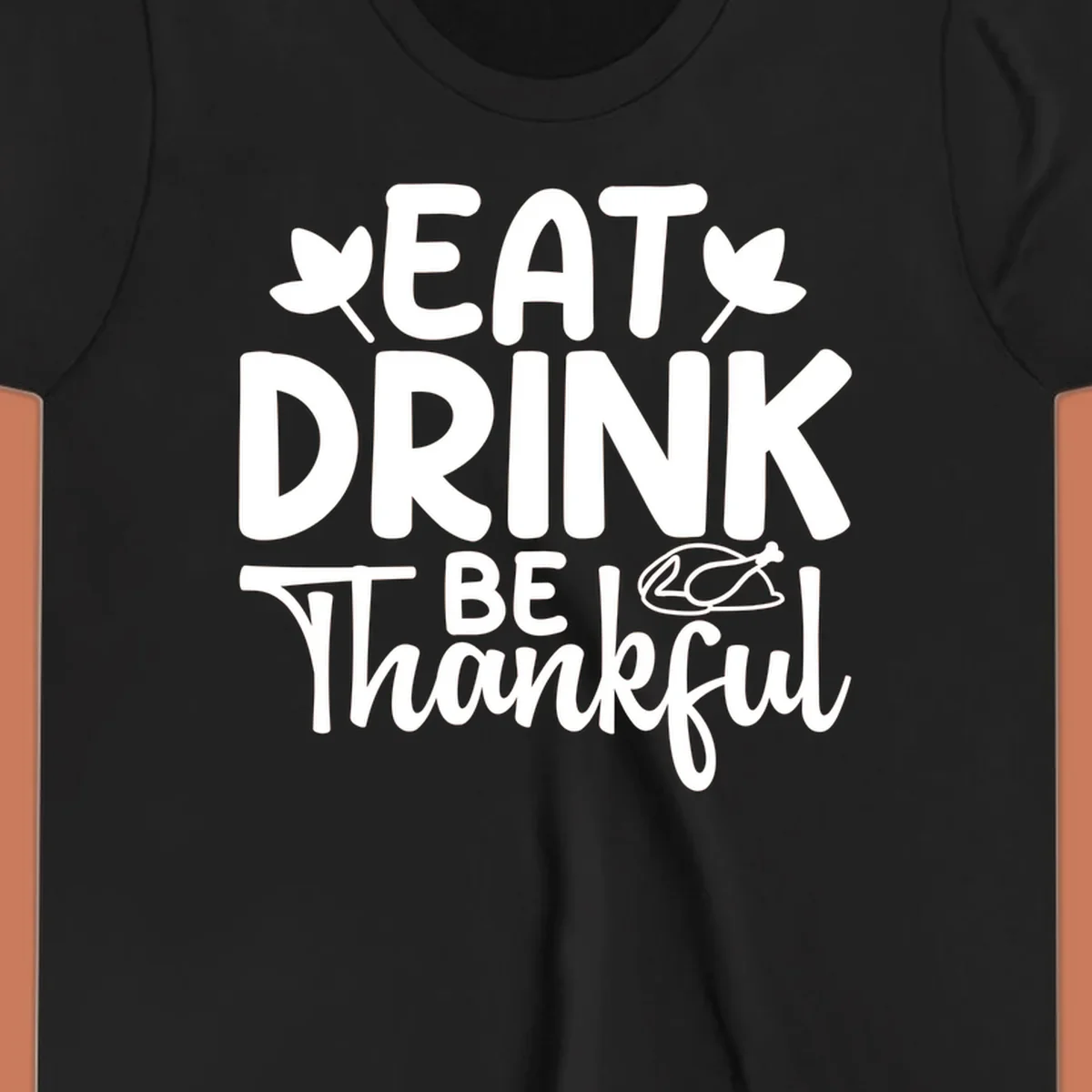 Eat Drink Be Thankful text with autumn leaves and a roasted chicken graphic.